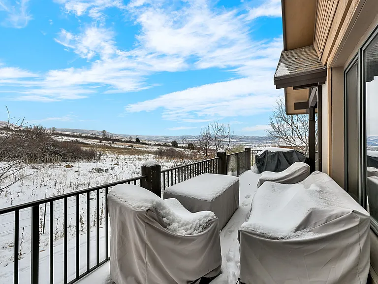 Main floor porch with blacktop grill, patio furniture and propane fire pit