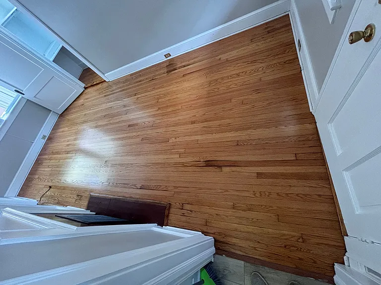 Living room hardwood floors sanded and refinished July 2024