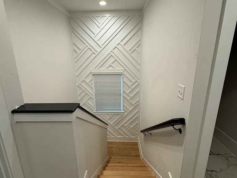Staircase. Decorative wall.