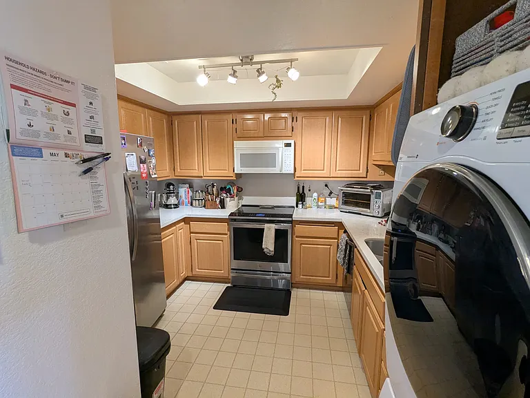 Kitchen and Stacked Washer/Dryer