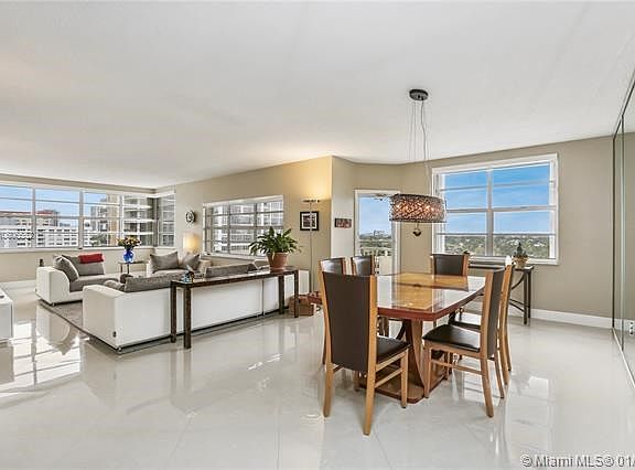 DINING AREA IS EASY ACCESS FROM THE KITCHEN....IMAGINE HAVING YOUR MEALS OVERLOOKING THE INTRACOASTAL AND THE BOATS GOING BY!