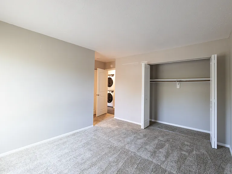 Primary Bedroom in the Two Bedroom Two Bath Apartment at Woodbridge Bloomington