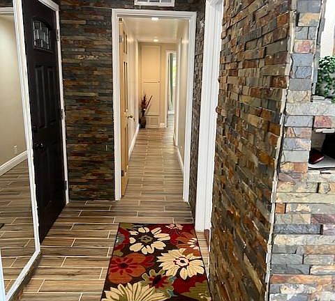 ENTRANCE AND HALLWAY TO BEDROOMS AND BATHROOM