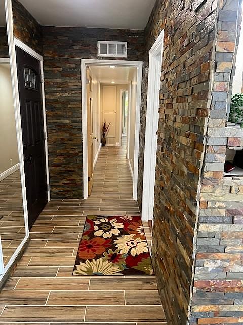 ENTRANCE AND HALLWAY TO BEDROOMS AND BATHROOM