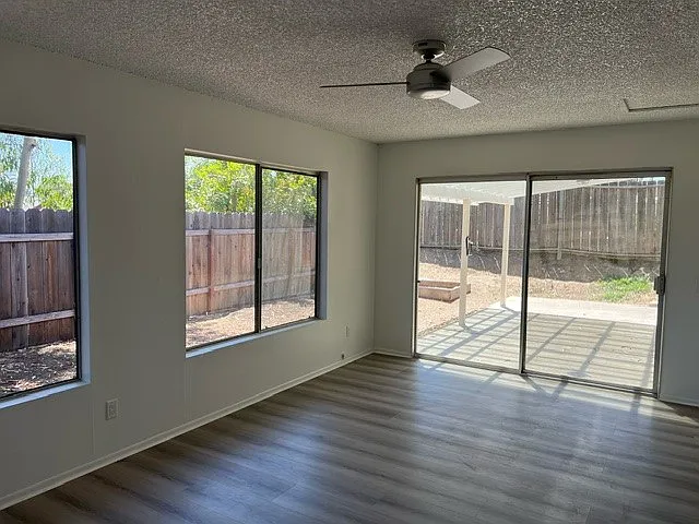 Family room with sliding door to covered patio area