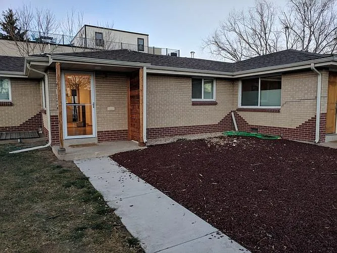Rubber mulch on the right is eco friendly. Grass on the left - 2130 Julian St