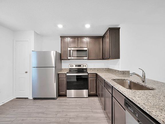 This move-in ready home features gorgeous granite countertops in the kitchen