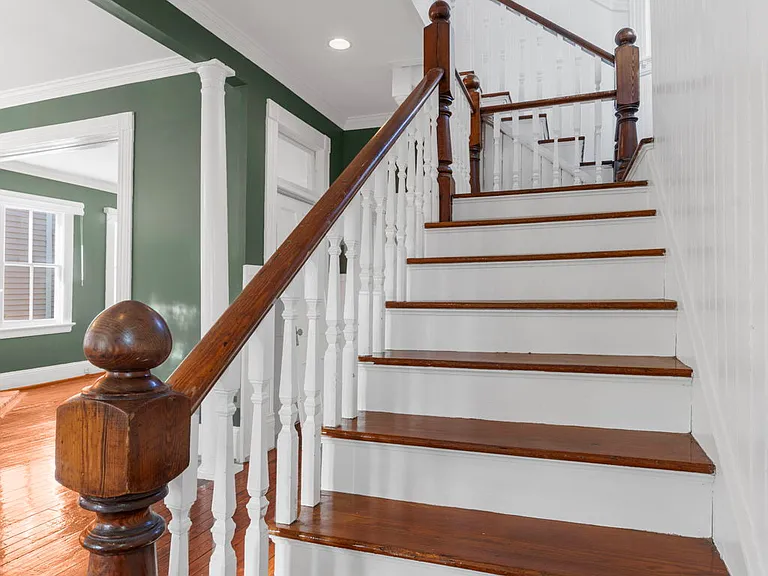 Staircase to the Second Floor with Three Bedrooms and Two Full Baths