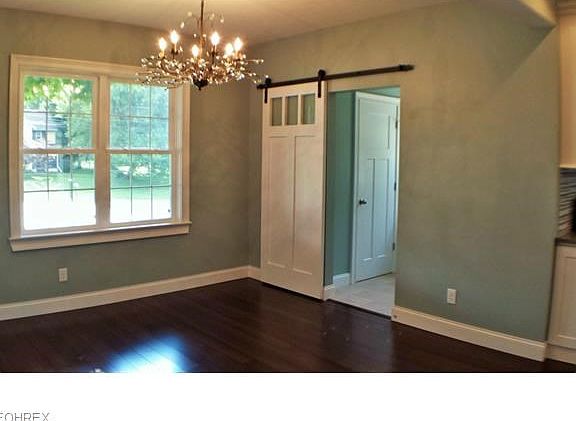 Custom barn door separates the DR from the laundry & half bath combination. Bamboo hardwood floors