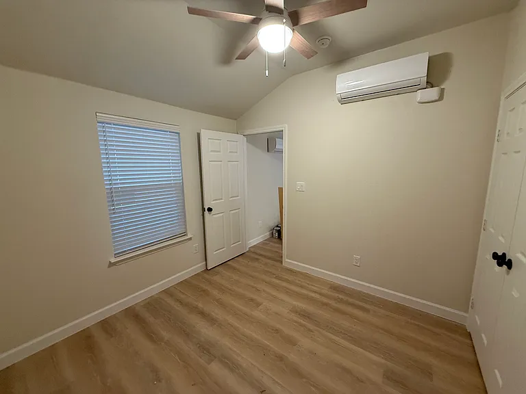 Bedroom with vaulted ceilings