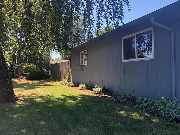 Side yard off street with back fence/gate to back patio area
