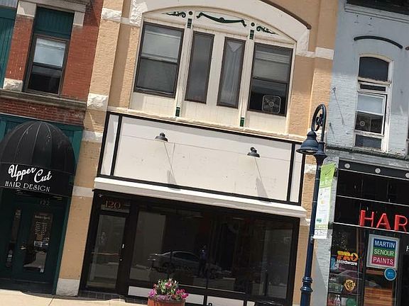 The windows in this apartment face Main Street. 