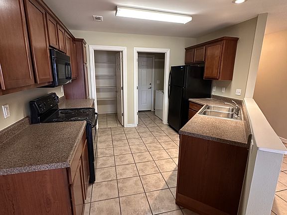 Kitchen with full pantry and garage access