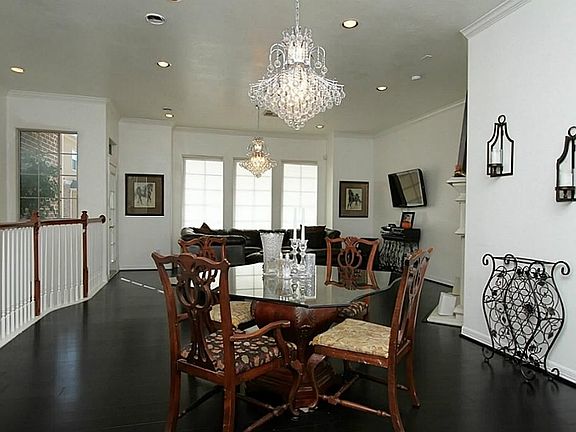 Beautiful chandeliers illuminate the dining area.