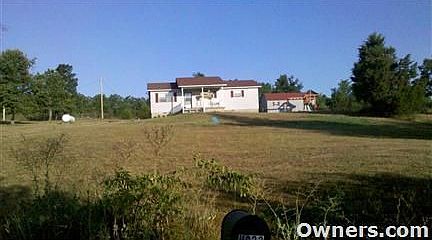 Front of house from dirt rd.