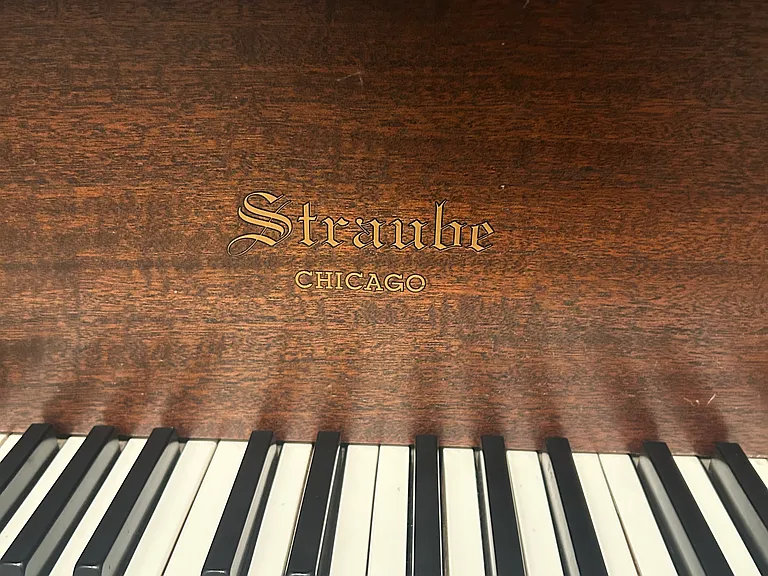 baby grand piano on lower level
