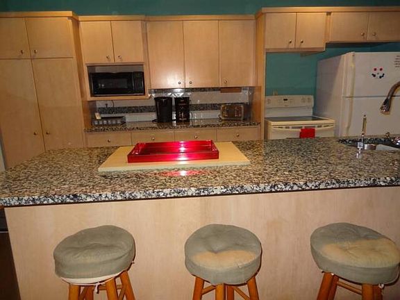 Kitchen with 6 bar stools.