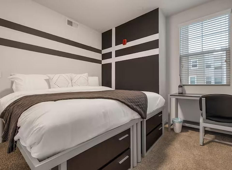 Get a good night's rest. This room is equipped with a king-size bed and a desk/chair.