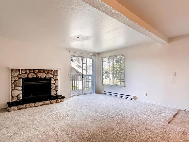 Our Apartments Living Room and Fireplace at Newport Heights Apartment in Tukwila Washington