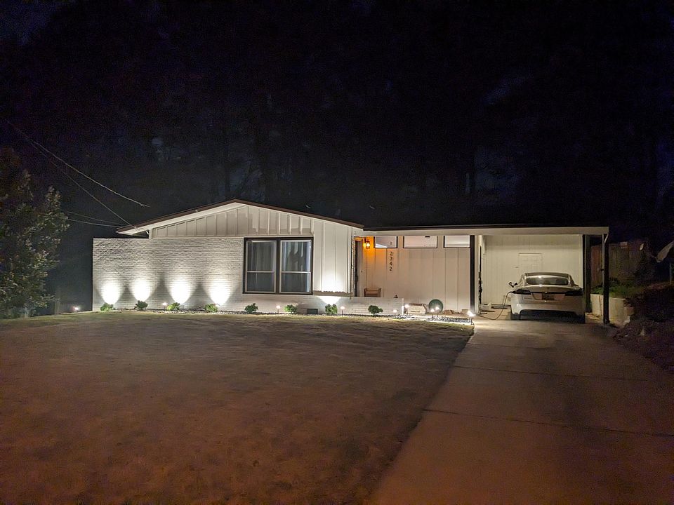 Contemporary modern design with brand new landscaping, lights, paint and siding.