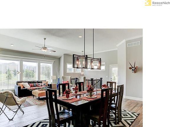 stairs to the back corner lead to the lower level. Door leads to the covered deck or patio.