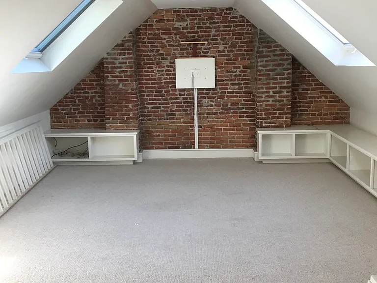 3rd floor with built-in cabinets, large skylights, and TV hookup