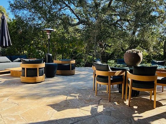 Outdoor deck/cooking/sitting area. Located immediately off the living room through a set of folding glass doors. Contains a full BBQ, 3 tap keg, and more.