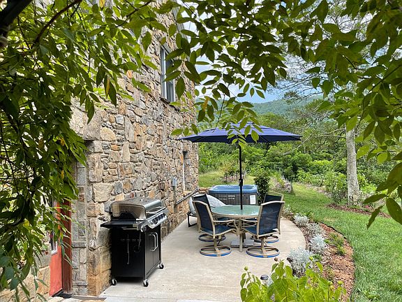 Gas BBQ with 2 tanks, table & chairs & umbrella, sun-bed & hot tub for 4 guests