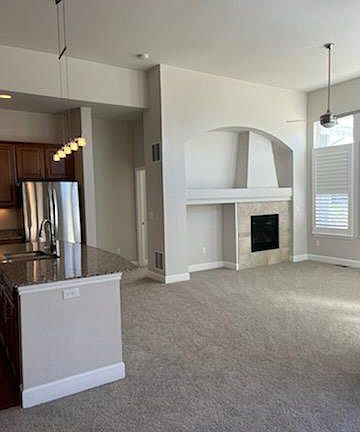 gas fireplace, custom wood shutters, ceiling fan, new carpet
