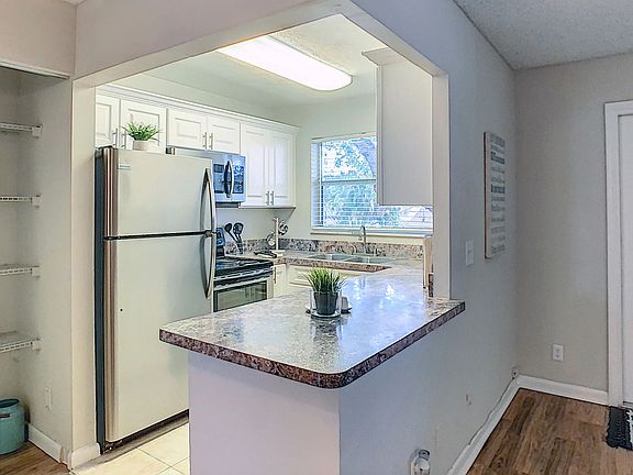 Elevate your culinary adventures with stainless steel appliances, a generous pantry, and ample countertop space. Cooking in style is part of the pleasure of apartment living at Boca Winds.