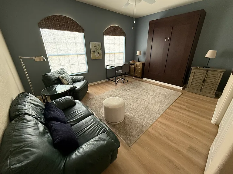 Guest bedroom with Murphy bed and
sitting area