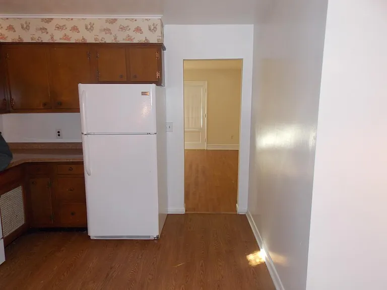 Kitchen looking into living room