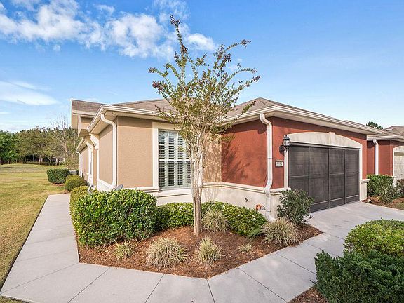 Front of villa, with screened garage.
