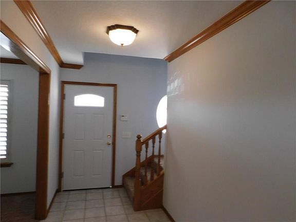 Entry open to stairs and optional/den formal dining