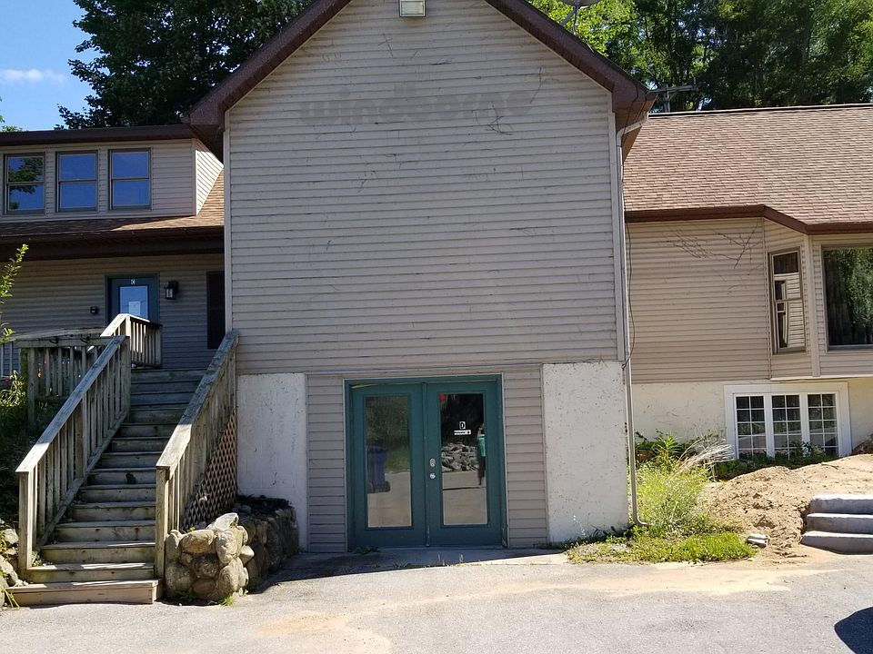 Front door to the apartment. Stairs to commercial section.