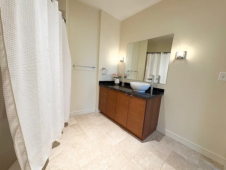 Second bedroom bath with full bath and shower