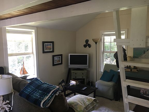 Light filled living space with vaulted ceiling