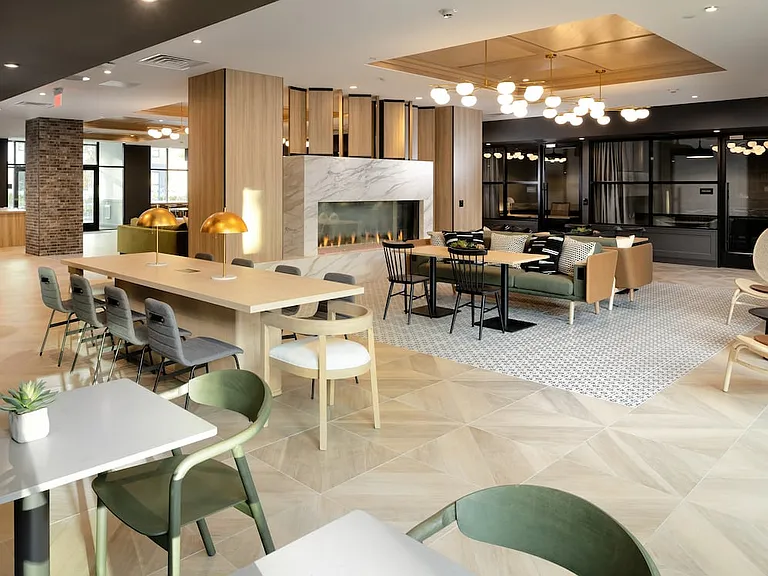Lobby and leasing area with fireplace and lounge seating