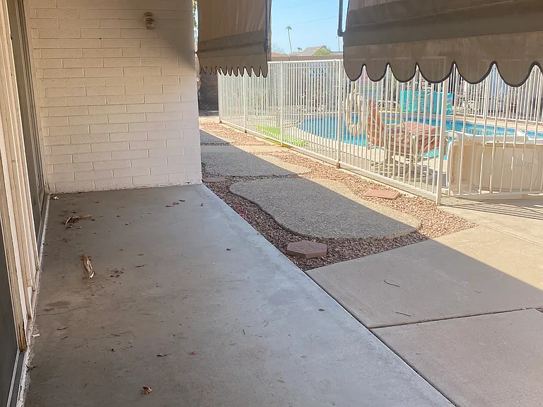 Patio overlooking the pool and courtyard