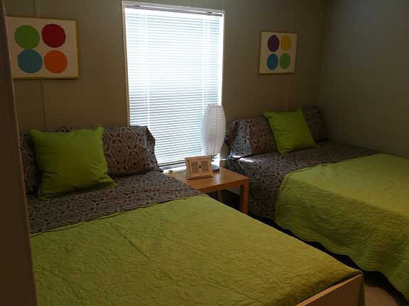 Bedroom with 2 full beds with TV