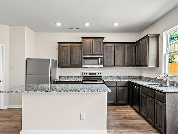 The chef-ready kitchen has upgraded fixtures and features.