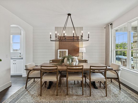 Formal dining area with large windows model representation