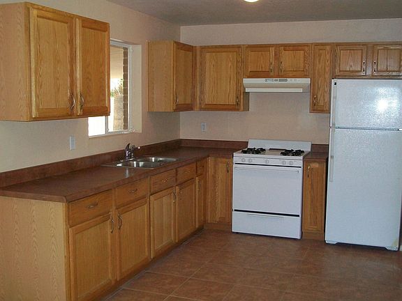 New kitchen: new counter, cabinets, appliances, texture, paint and 16" tile