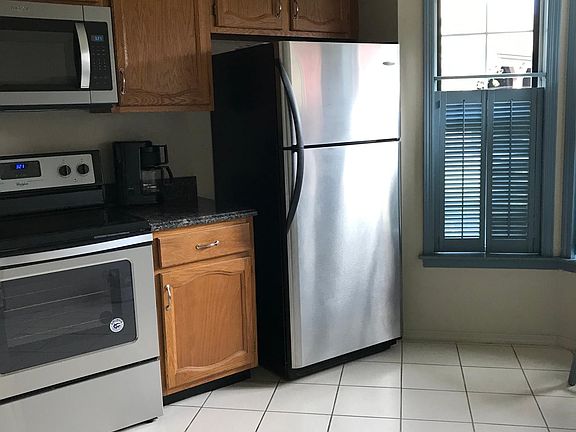 Stainless steel appliances in a bright and sunny kitchen