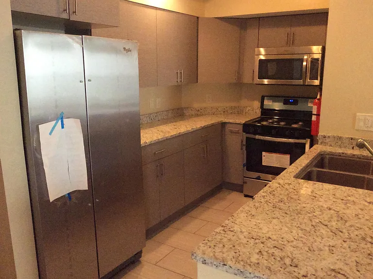 Kitchen showing stainless steel appliances and granite countertops