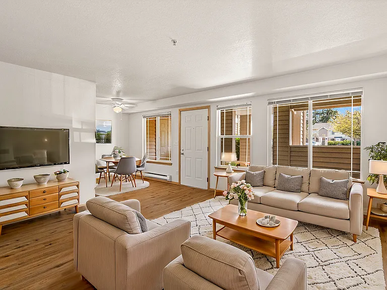 Experience contemporary elegance in this well-lit living space perfect for relaxation and entertaining. Experience contemporary elegance in this well-lit living space perfect for relaxation and entertaining.