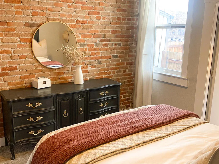 Exposed brick in bedroom
