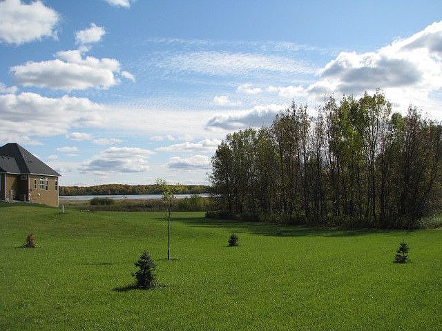 Side yard with lots of green space.