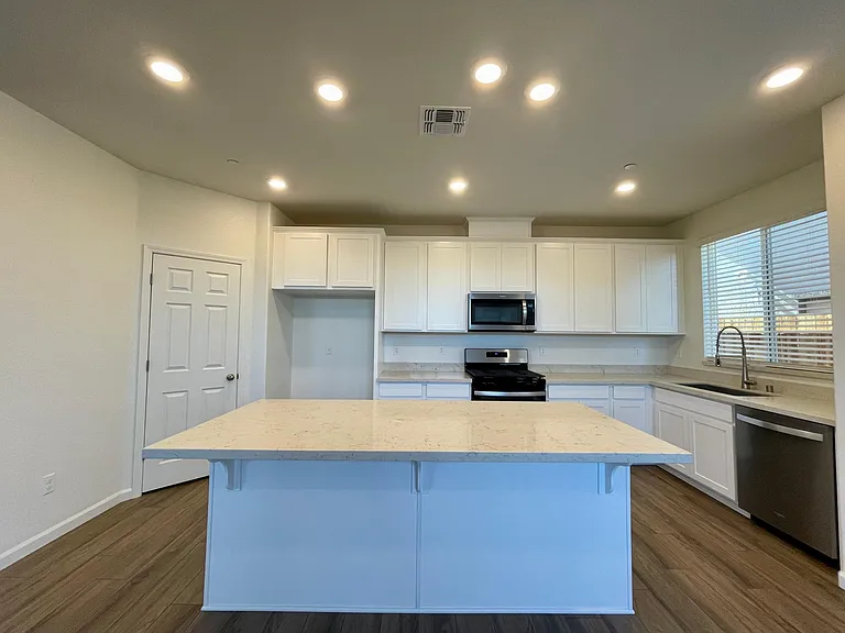 Open Concept Kitchen with a large island and pantry