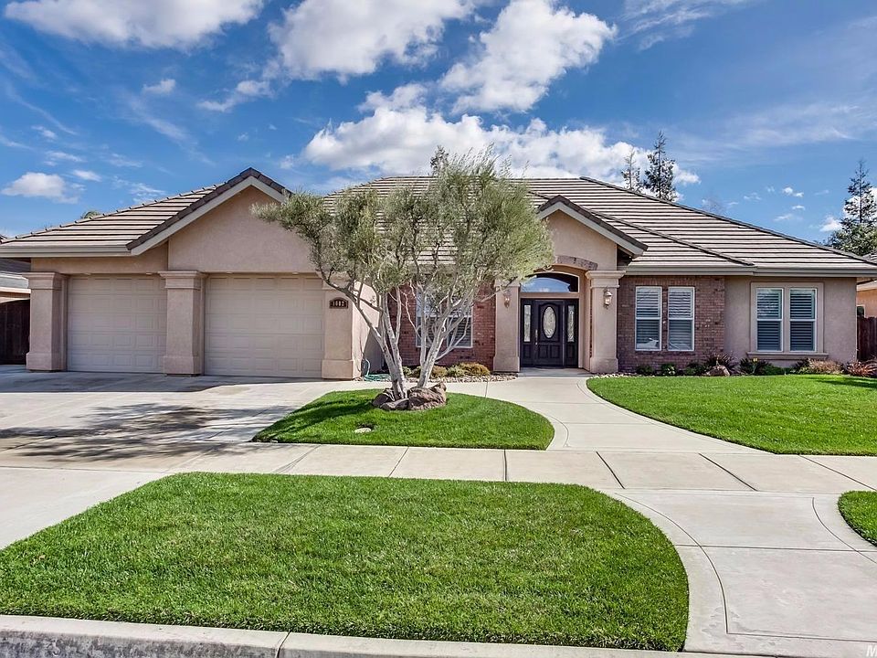 Gorgeous Magnolia Terrace custom home on .2 acre lot featuring an open floor plan with delightful upgrades, a lovely yard with attractive landscaping and a 12' side yard with RV pad and gate!